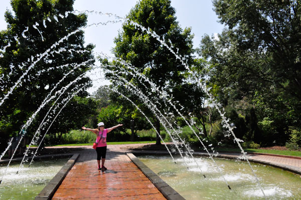 Karen Duquette getting wet at the water fountain